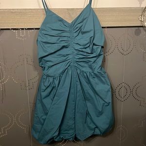 Endless rose puff romper in emerald.